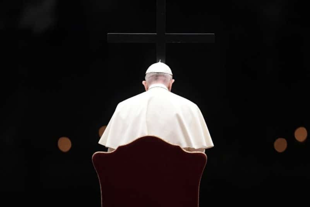 The late Pope Francis gazes at the cross.
